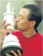  ??  ?? The police mugshot of Tiger Woods that went viral and the superstar in his halcyon days as he plants a kiss on the Claret Jug after his 2000 victory.