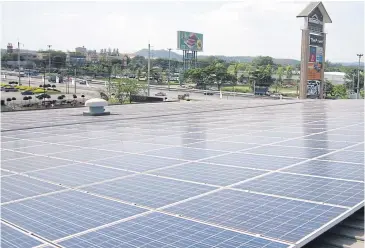  ??  ?? A solar rooftop on a mall in Nakhon Ratchasima. Similar systems are growing in popularity with consumers.