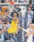  ?? AP ?? Jazz guard Donovan Mitchell shoots against the 76ers in Salt Lake City.