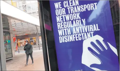  ?? Alastair Grant The Associated Press ?? A display on a bus stop informs passengers of cleaning protocols to prevent the spread of COVID-19 at Oxford Street in London.