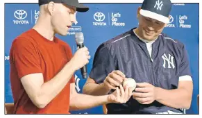  ?? Bill Kostroun ?? HAVING A BALL: Zack Hample, who caught Alex Rodriguez’s 3,000th career hit, presents the ball to Rodriguez during a press conference before the Yankees’ 7-5 victory over the Rays.