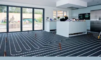  ??  ?? Left: e Lopro Max UFH system from Nu-heat (www.nu-heat.co. uk) offers high heat outputs of up to 120 W/m in a slim profile – typically requiring just 22mm of floor height build-up