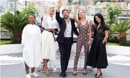  ?? Photograph: Niviere David/ABACAPRESS.COM/Shuttersto­ck ?? Waving not drowning … Rungano Nyoni, Julia Ducournau, Ruben Östlund, Brie Larson and Maryam Touzani at the jury photocall.