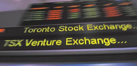  ?? THE CANADIAN PRESS/FRANK GUNN PHOTO ?? The TSX ticker is shown in Toronto in 2013. Investors should expect more modest returns in 2018 rather than what was seen last year.