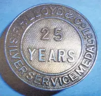  ??  ?? A badge for 25 years’ service