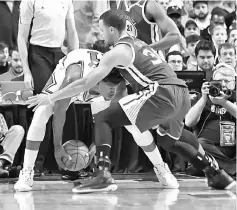  ??  ?? Golden State Warriors’ Stephen Curry defends Chicago Bulls’ Jimmy Butler during the second half at the United Center. — David USA TODAY Sports photo