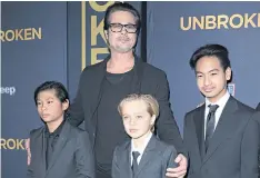  ??  ?? Brad Pitt with his children Pax, left, Shiloh and Maddox Jin 2014.