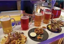  ?? ?? TASTY. Cucumber-flavored beer and sisig nachos; Watermelon-flavored beer and Buffalo chicken tenders; Caramel beer and six-hour roast beef; and Peach beer and Mexican beer birria.