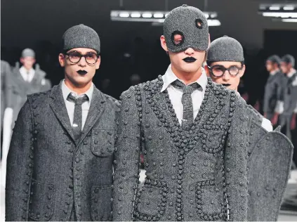  ?? Picture: EPA ?? LITTLE GREY MEN. Models present creations from the Fall/Winter 2017/18 Men’s collection by American fashion designer Thom Browne during the Paris Fashion Week, in Paris, France, on Sunday.