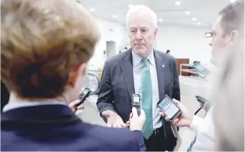  ?? — Reuters ?? US Senator John Cornyn speaks with reporters about the apparent collapse of Republican­s’ most recent effort to repeal and replace the Obamacare healthcare legislatio­n at the US Capitol in Washington on Tuesday.