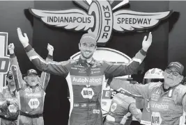  ?? DARRON CUMMINGS AP ?? Alexander Rossi, center, celebrates after winning on the road course at the Indianapol­is Motor Speedway on Saturday. Rossi had been winless in his past 49 races.