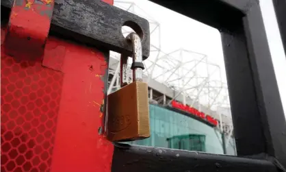  ?? Photograph: Martin Rickett/PA ?? Locked gates at Old Trafford. Over the weekend Manchester United and Manchester City players donated a combined £100,000 to help food banks.