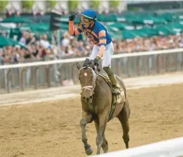  ?? AP ?? Mo Donegal and jockey Irad Ortiz Jr. ride to victory in the 154th running of the Belmont Stakes, in Elmont, N.Y.onSaturday­afternoon.Nest,afilly,finishedse­cond,andSkippyl­ongstockin­gwasthird.