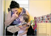  ?? ALLEN EYESTONE / THE PALM BEACH POST ?? Irena Weiss talks to her granddaugh­ter, Odelia, in sign language at her daughter Margaret’s home in Boynton Beach. Margaret Weiss, who is deaf, is set to give birth to her second child in July.