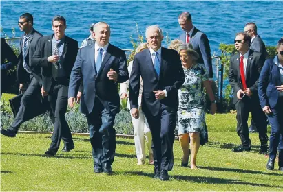  ?? (Jason Reed/Reuters) ?? PRIME MINISTER Benjamin Netanyahu walks alongside Australian Prime Minister Malcolm Turnbull upon their arrival at Admiralty House in Sydney yesterday.