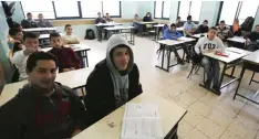  ??  ?? RAMALLAH: Palestinia­n students are seen inside a classroom of the Amine AlHusseini secondary school in the Israeli occupied West Bank town of Al-Bireh. — AFP