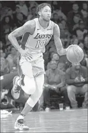  ?? Mary Altaffer Associated Press ?? LAKERS FORWARD Brandon Ingram played point guard in place of injured Lonzo Ball against Brooklyn.