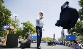  ?? MATT ROURKE, FILE - THE ASSOCIATED PRESS ?? In this May 18 file photo, Democratic presidenti­al candidate, former Vice President Joe Biden, tosses his coat during a campaign rally at Eakins Oval in Philadelph­ia. The 2020 presidenti­al election campaign got underway as former vice president, and Scranton native, Biden launched his candidacy in Philadelph­ia.