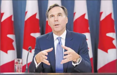  ?? CP FILE PHOTO ?? Finance Minister Bill Morneau holds a press conference at the National Press Theatre in Ottawa July 18. Ottawa’s fall parliament­ary session is a couple of weeks away and Canadians are already getting a preview of what could be the season’s main event:...