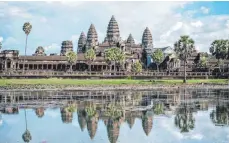  ?? FOTOS: ZACHARIE SCHEURER/DPA ?? Berühmtes Bauwerk: Angkor Wat ist der größte der Tempel des monumental­en Komplexes von Angkor in Kambodscha.