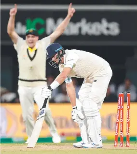  ?? ?? England’s Joe Root loses his wicket to Australian paceman Scott Boland at Blundstone Arena. Picture: Robert Cianflone/Getty Images