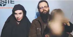  ??  ?? CAPTIVES: Caitlan Coleman, and her Canadian husband Joshua Boyle, holding their children, in an undated video grab. Picture: AFP