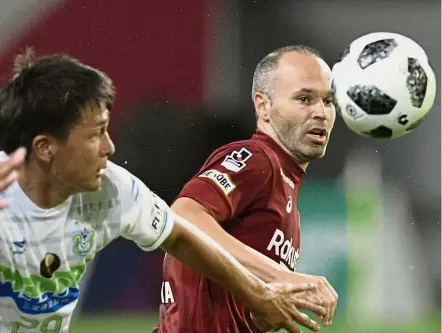  ??  ?? Crowd puller: Vissel Kobe’s Andres Iniesta (right) controllin­g the ball during the J-League match against Shonan Bellmare in Kobe yesterday. — AP