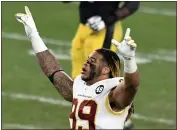  ?? BARRY REEGER — THE ASSOCIATED PRESS ?? Washington Football Team defensive end Chase Young (99) celebrates after a 23-17 win over the Steelers on Monday in Pittsburgh.