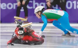  ?? AP PHOTO ?? Jamie Macdonald of Canada crashes in women’s 500 meters short-track speedskati­ng in the Gangneung Ice Arena at the 2018 Winter Olympics in Gangneung, South Korea on Saturday.