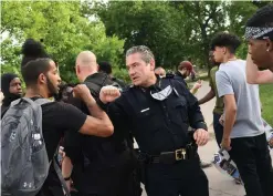  ?? RJ Sangosti, The Denver Post ?? Denver Police Chief Paul Pazen thanks protesters after joining a peaceful protest over the death of George Floyd.