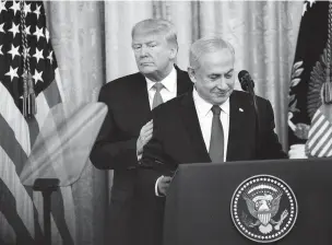  ?? DOUG MILLS/NEW YORK TIMES ?? President Donald Trump and Israeli Prime Minister Benjamin Netanyahu attend a ceremony Tuesday at the White House at which Trump released a long-awaited Middle East peace plan.