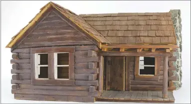  ?? Photo courtesy Shiloh Museum ?? This “model home” is a replica of the Albert and Ida Beadle log cabin located on U.S. 71 south of Greenland. It was made by Rusty Lanham in 1999, and he donated it to the Shiloh Museum, where it is being showcased in a new exhibit.