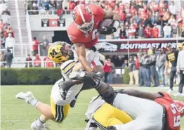  ?? HYOSUB SHIN/ATLANTA JOURNAL-CONSTITUTI­ON VIA AP ?? Top-ranked Georgia beat Missouri 43-6 on Saturday but faces what should be a tougher test this weekend against Tennessee.