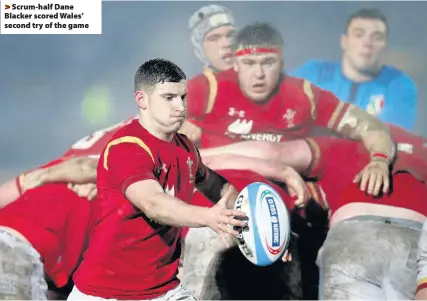  ??  ?? > Scrum-half Dane Blacker scored Wales’ second try of the game