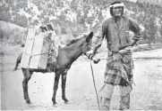  ?? PHOTO COURTESY MARC SIMMONS ?? A Navajo man selling fruit from the back of his burro, in about 1890. In the 19th century, a flourishin­g overland commerce developed on the Santa Fe and Chihuahua trails.