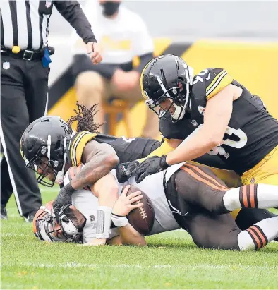  ?? JOE SARGENT/GETTY ?? The Browns’ Baker Mayfield is sacked by the Steelers’ Bud Dupree earlier this season in Pittsburgh. The Browns must beat the rival Steelers in Sunday’s finale in Cleveland in order to break their playoff drought.