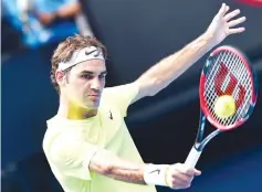  ??  ?? Switzerlan­d’s Roger Federer plays a shot during his men’s singles match against Italy’s Simone Bolelli on day three of the 2015 Australian Open tennis tournament in Melbourne on January 21, 2015. - AFP photo