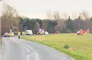  ?? Police and the air ambulance at the scene of the lorry crash ??
