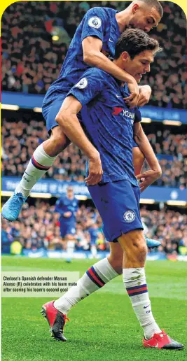  ??  ?? Chelsea's Spanish defender Marcos Alonso (R) celebrates with his team mate after scoring his team's second goal