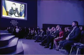  ?? MARKUS SCHREIBER/AP ?? President Volodymyr Zelenskyy of Ukraine, via video, urges world leaders gathered at Davos to help his nation fight an invasion by Russia.