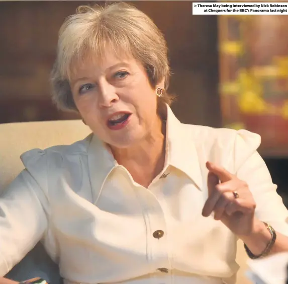  ?? Jeff Overs/BBC ?? > Theresa May being interviewe­d by Nick Robinson at Chequers for the BBC’s Panorama last night