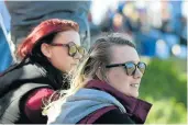  ??  ?? HOT RACE: Courtney, left, and Juan-Mari Botha watched along the sideline as cars did their tricks at the Supa Drift Series at the Scribante racecourse last weekend