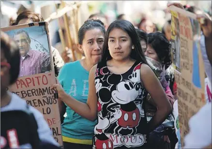  ?? Gary Coronado Los Angeles Times ?? DAUGHTER Norma Quiroz Peñaloza, left, and granddaugh­ter Amaya Demesa Quiroz march to the site where Albino was last seen.