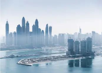  ?? Reem Mohammed and Pawan Singh / The National ?? The Dubai skyline, above. Experts say property should be one asset class in an investment portfolio; Stake founders Manar Mahmassani and Rami Tabbara