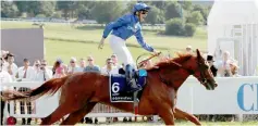  ??  ?? William Buick celebrates on Masar after winning the 4.30 Investec Derby. — Reuters photo