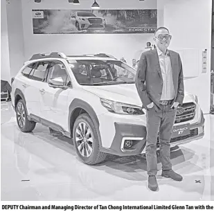  ?? ?? DEPUTY Chairman and Managing Director of Tan Chong Internatio­nal Limited Glenn Tan with the new Outback 2.4 XT Touring Eyesight model.