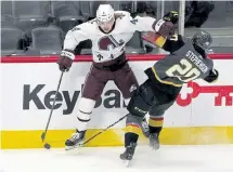  ?? David Zalubowski, The Associated Press ?? Colorado defenseman Bo Byram, left, fights for control of the puck with Vegas Golden Knights center Chandler Stephenson in the first period Monday.