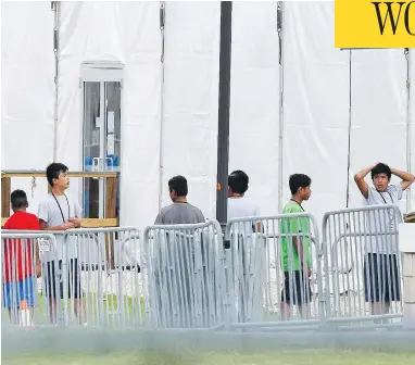  ?? BRYNN ANDERSON/THE ASSOCIATED PRESS ?? Children separated from their parents are pictured at a Miami-area detention centre for illegal immigrants on Wednesday. “Obviously this is not the way we do things in Canada,” said Prime Minister Justin Trudeau.