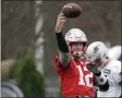  ?? STEVEN SENNE - THE ASSOCIATED PRESS ?? New England Patriots quarterbac­k Tom Brady throws the ball while warming up during an NFL football practice, Wednesday, Nov. 20, 2019, in Foxborough, Mass.