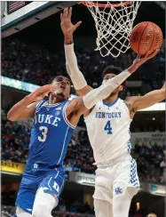  ??  ?? AP PHOTO BY AJ MAST Duke guard Tre Jones (3) next to Kentucky forward Nick Richards (4) during the first half of an NCAA college basketball game at the Champions Classic in Indianapol­is on Tuesday, Nov. 6.